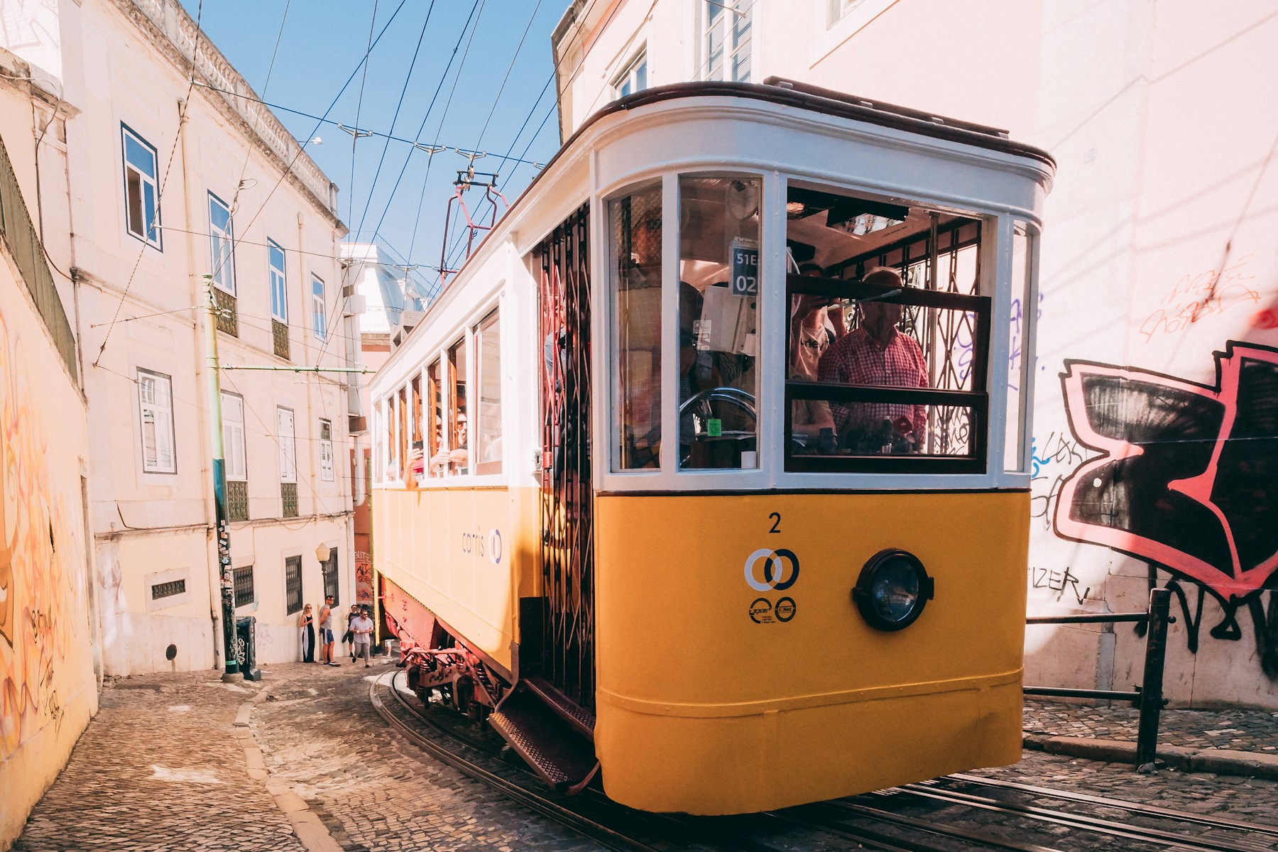 Lisbon rooftops and terracotta buildings in warm light